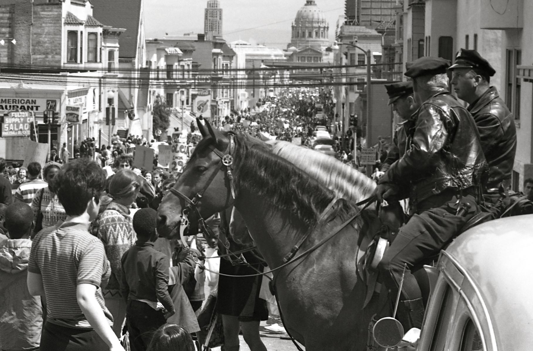 Mounted policemen watch a Vietnam War protest march in San Francisco April 1967